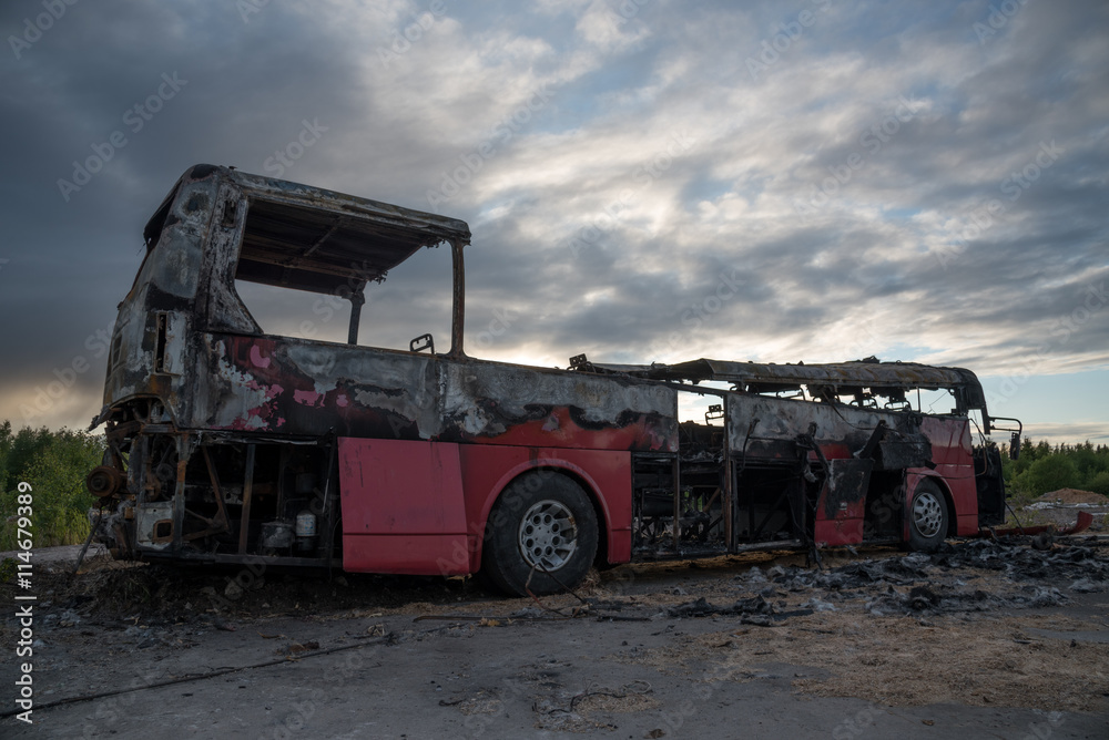 burned bus at sunset / dawn