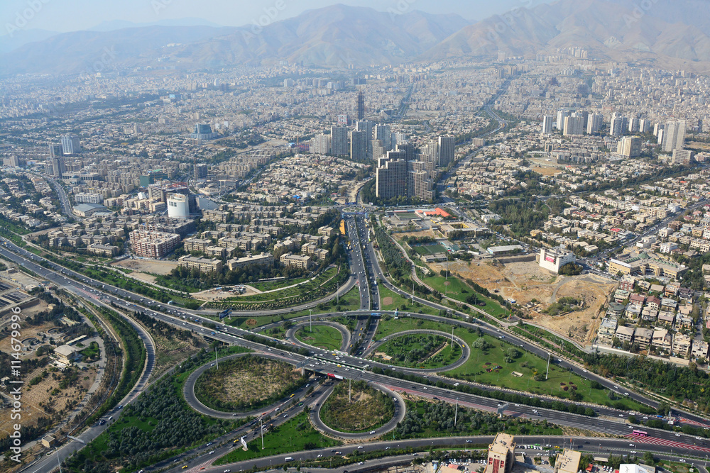 Road junction and buildings in north Tehran, Iran