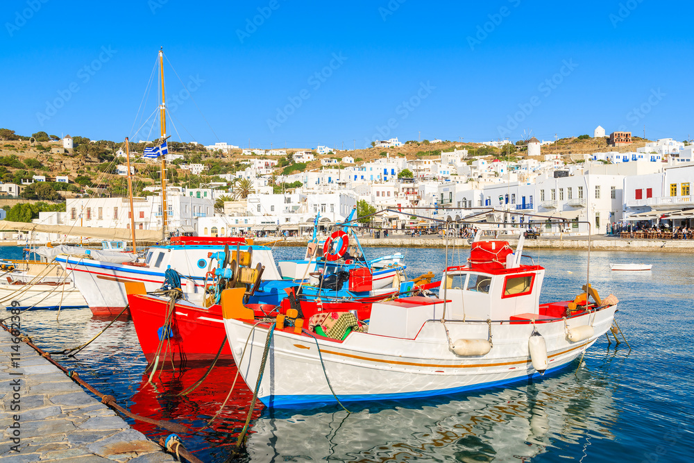 Typical colorful Greek fishing boats in Mykonos town port on island of Mykonos, Cyclades, Greece