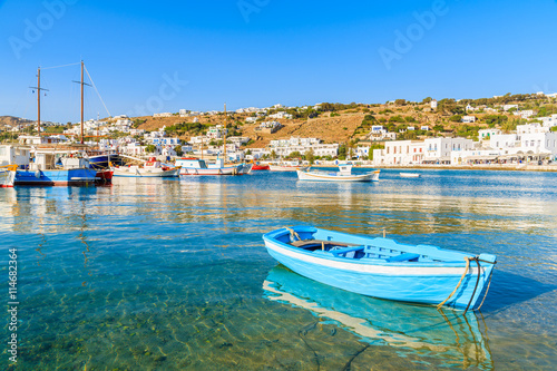 Typical blue and white color Greek fishing boat in Mykonos port on island of Mykonos, Cyclades, Greece