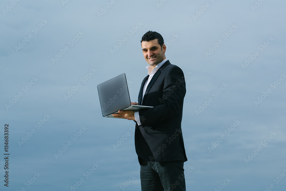 businessman with laptop outdoor