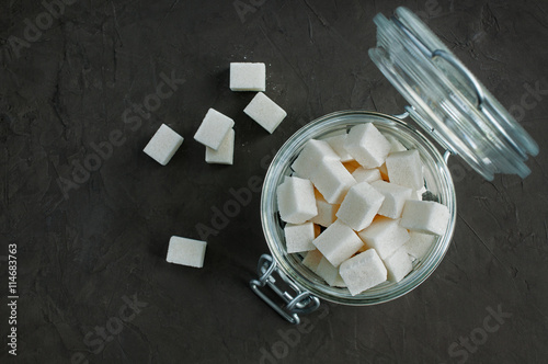 Obraz na plátně White cubes sugar in a glass jar