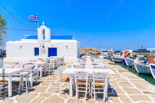 Square with typical white Greek church in Naoussa port, Paros island, Cyclades, Greece