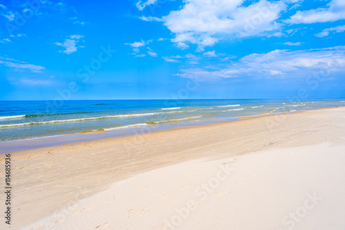 A view of white sand beach and blue Baltic Sea  Bialogora coastal village  Poland