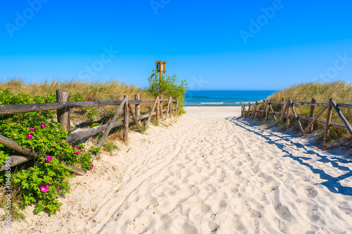 Entrance to beautiful sandy beach in Lubiatowo coastal village, Baltic Sea, Poland