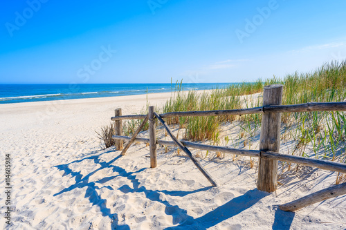 Entrance to beautiful sandy beach in Lubiatowo coastal village, Baltic Sea, Poland