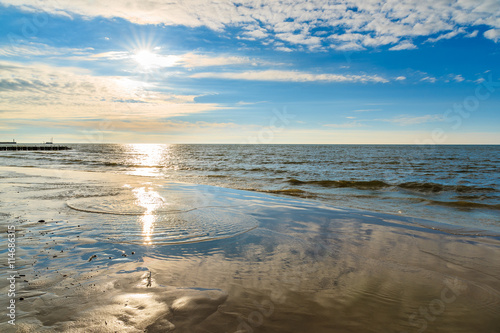 Sun shining over sea on Leba beach  Baltic Sea  Poland