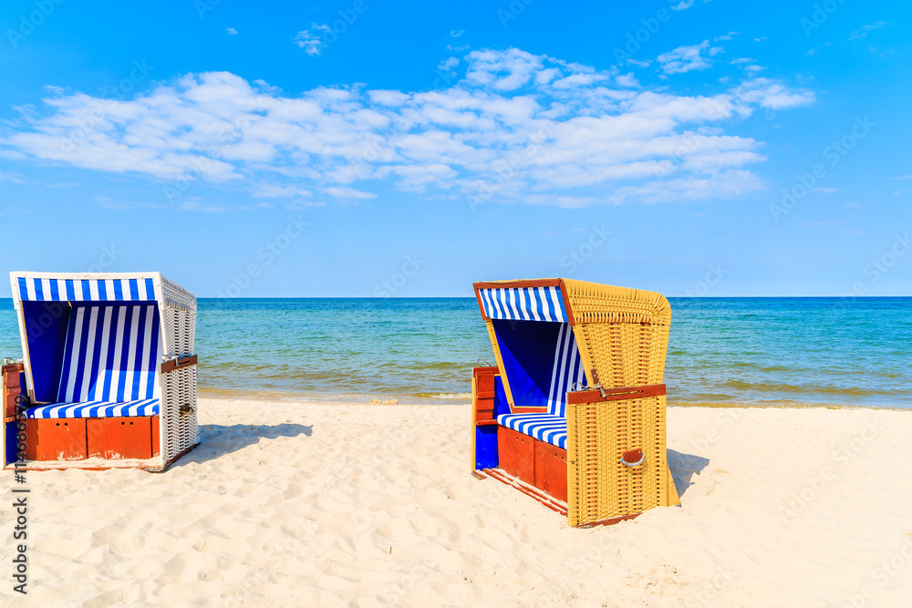 Colorful wicker chairs on sandy Jurata beach, Baltic Sea, Poland Colorful wicker chairs on sandy Jurata beach, Baltic Sea, Poland