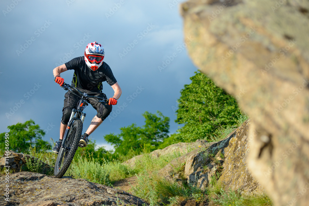 Professional Cyclist Riding the Bike on the Beautiful Spring Mountain Trail. Extreme Sports