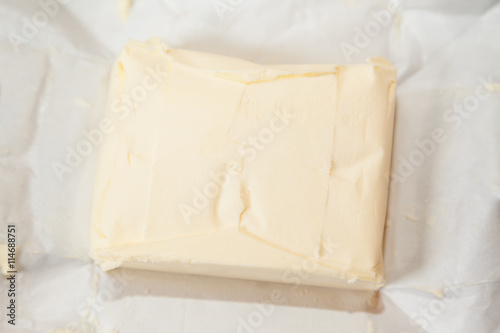 Closeup of open bricket of butter with selective focus