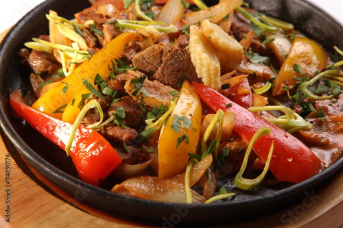 hot frying pan with beef and Mexican seasoning