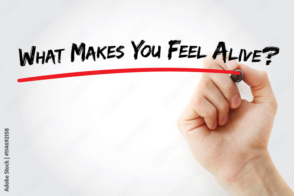 Fototapeta premium Hand writing What Makes You Feel Alive? with marker, concept background