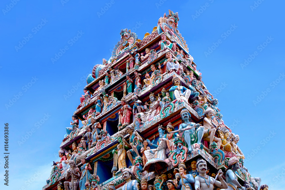 indian temple god statur against blue sky