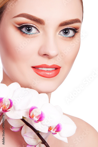 Girl  portrait of a beautiful young girl with flower  with a professional makeup