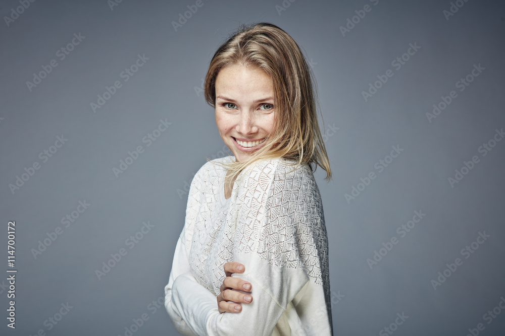 Portrait of smiling blond woman with arms crossed Portrait of smiling blond woman with arms crossed