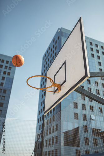 Basketball flying towards hoop photo