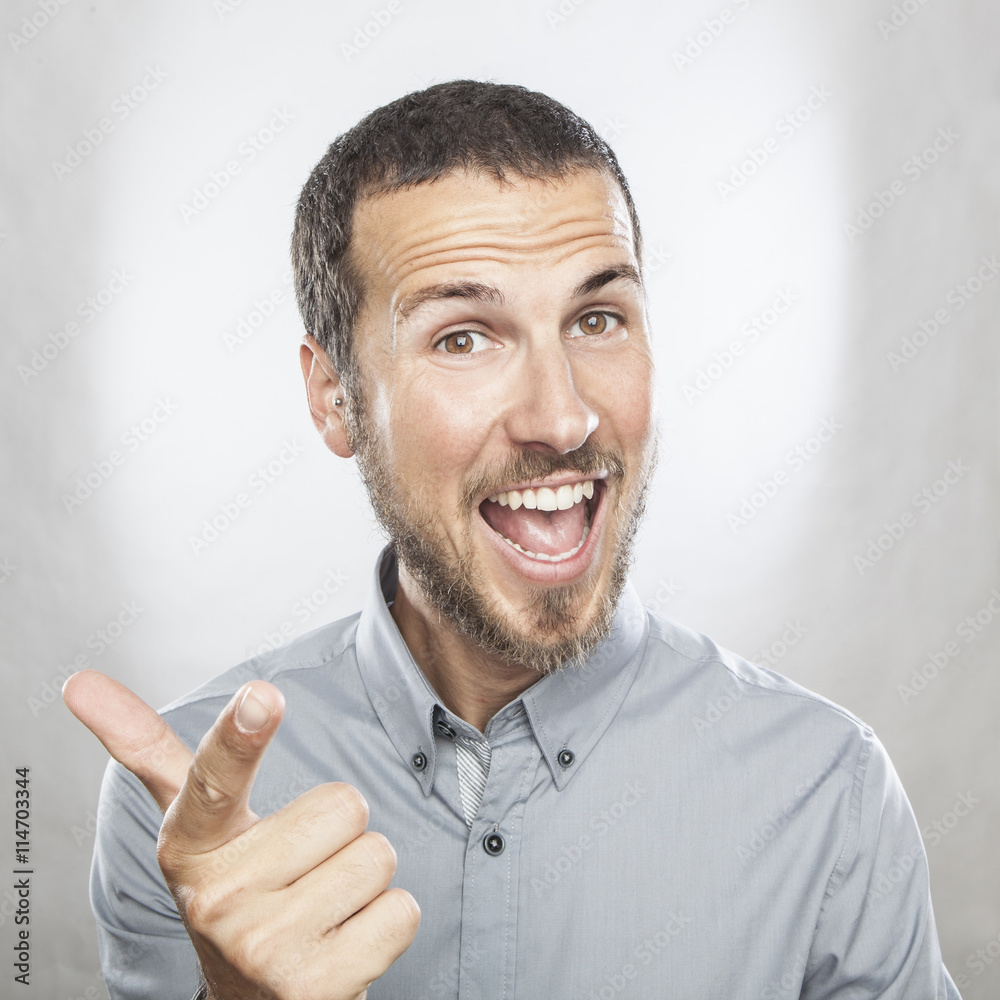 portrait of a young beautiful man smiling, face expression