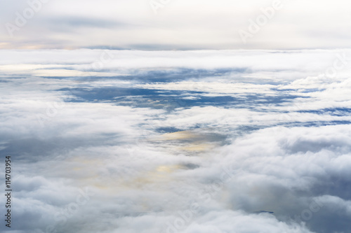 Aerial view from an airplane on a cloudy day.