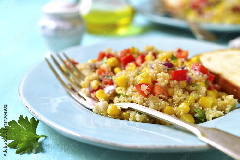 Quinoa salad with bell pepper,tomatoes,red onion,sweet corn and