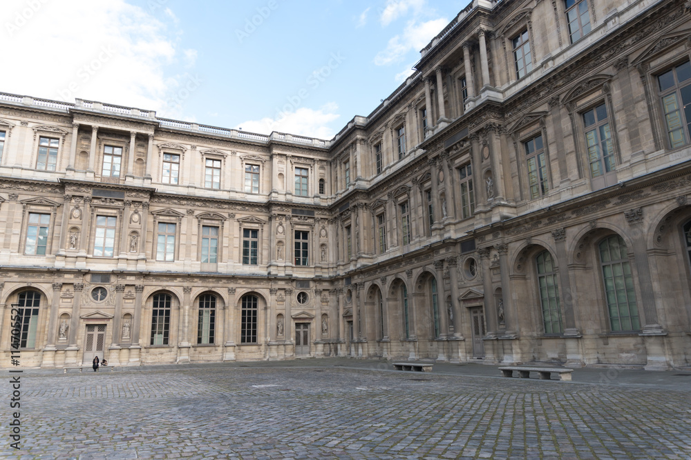 Paris, France - April 28, 2016: Louvre building in Paris, France. With 9 million annual visitors, Louvre is consistently the most visited museum worldwide