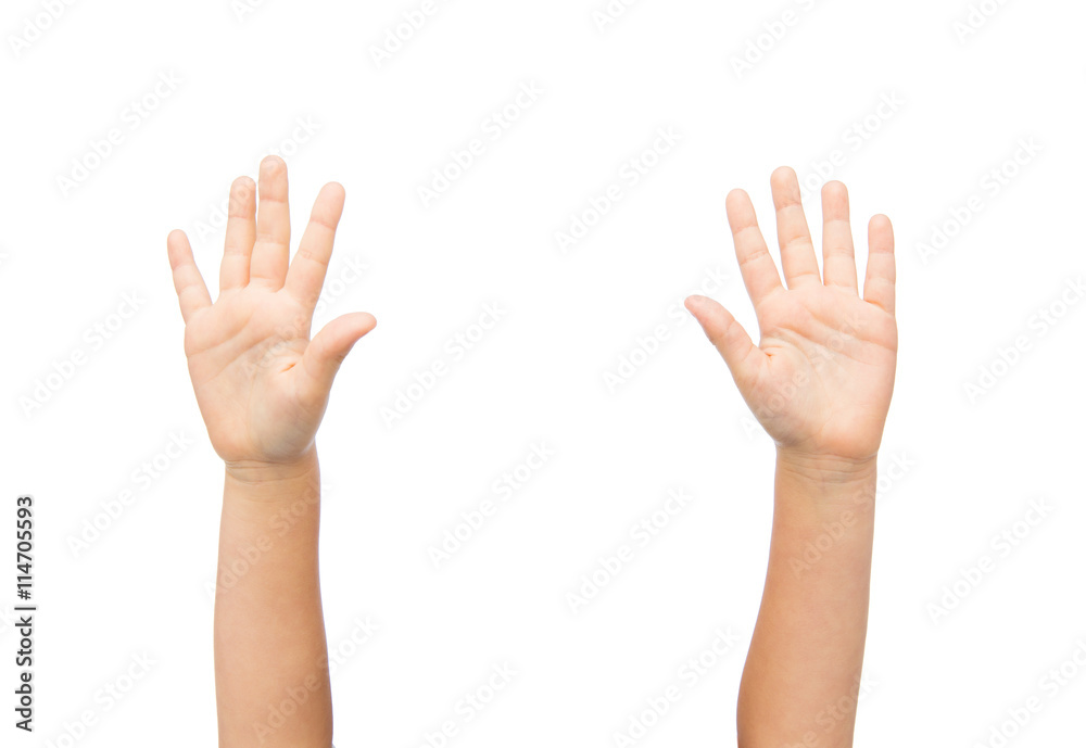 close up of little child hands raised upwards