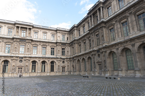 Paris, France - April 28, 2016: Louvre building in Paris, France. With 9 million annual visitors, Louvre is consistently the most visited museum worldwide