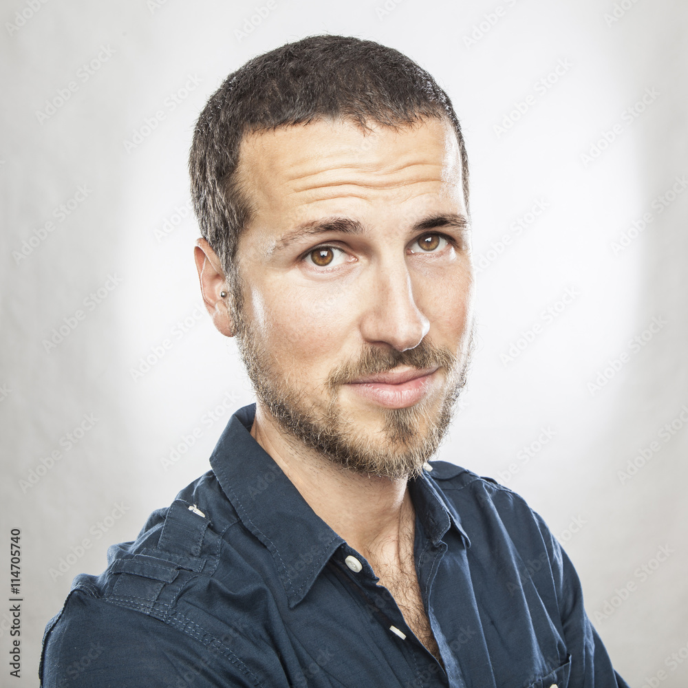 Obraz premium portrait of a young beautiful man smiling, face expression