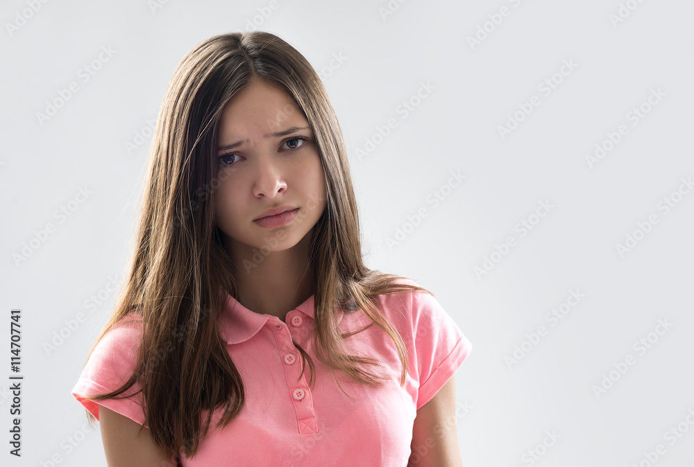 portrait of a beautiful young brunette in the studio on a white background portrait of a beautiful young brunette in the studio on a white background