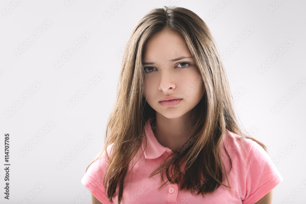 portrait of a beautiful young brunette in the studio on a white background portrait of a beautiful young brunette in the studio on a white background