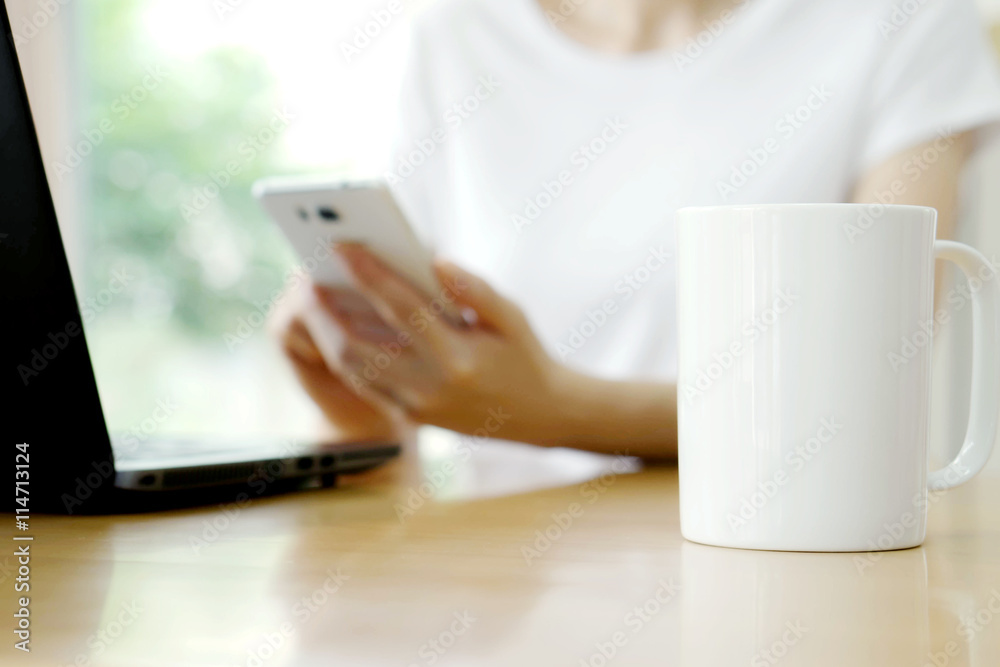Businesswoman Working Using Laptop and mobile phone Businesswoman Working Using Laptop and mobile phone