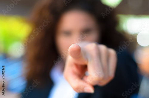 Woman pointing an accusatory finger at the camera