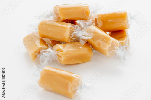 Individually wrapped caramel or fudge candy pieces