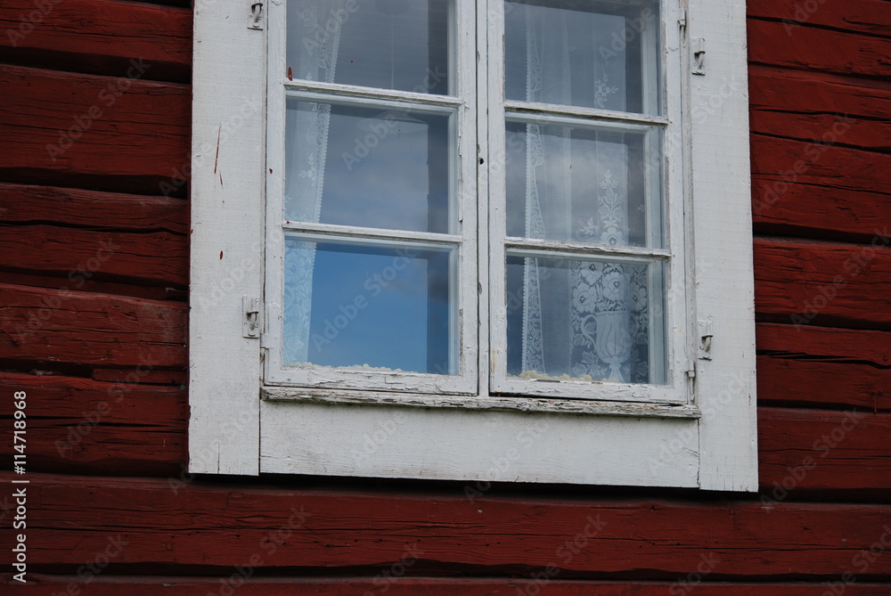 Old window in red wall