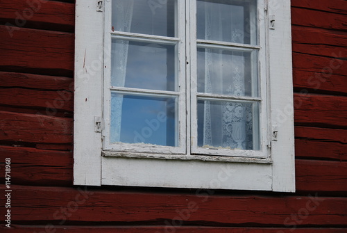 Old window in red wall