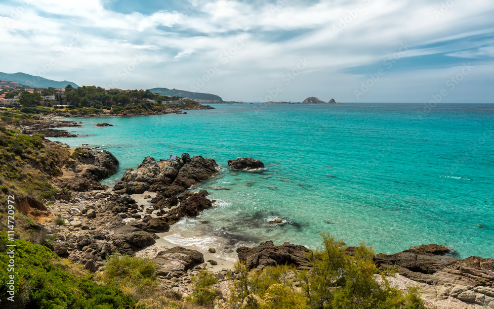 Translucent sea and rocky coastline of Corsica near Ile Rousse Translucent sea and rocky coastline of Corsica near Ile Rousse