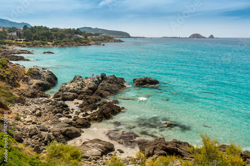 Translucent sea and rocky coastline of Corsica near Ile Rousse