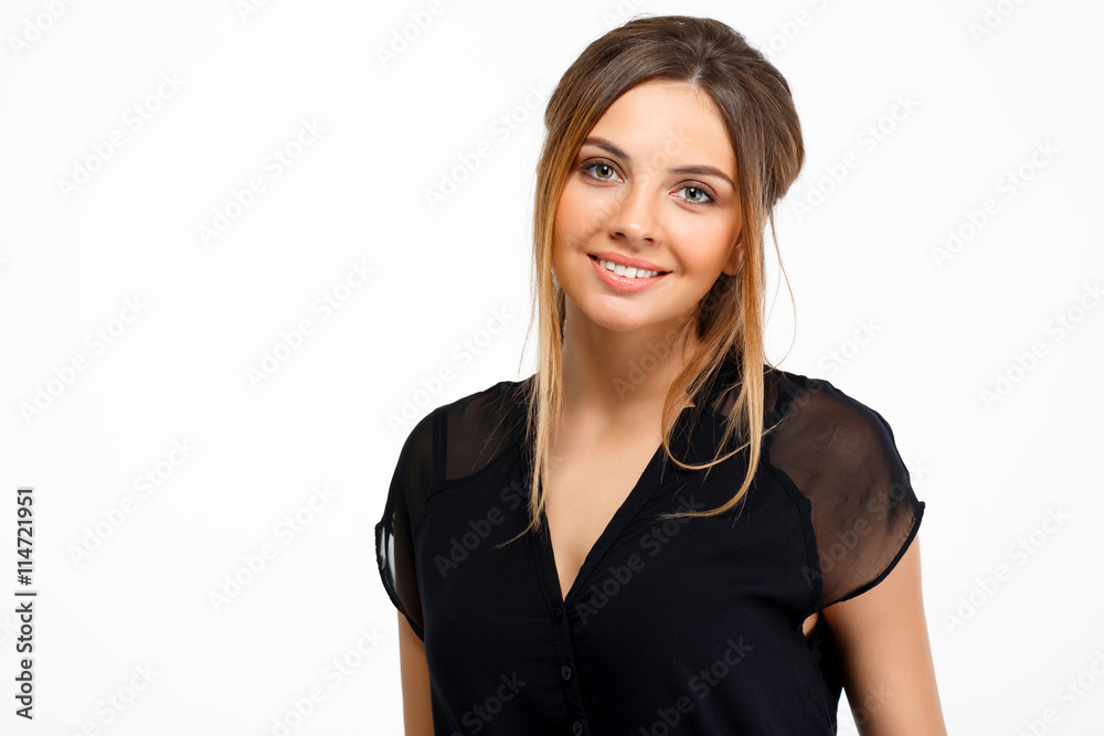 Portrait of young beautiful girl over white background. Copy space.