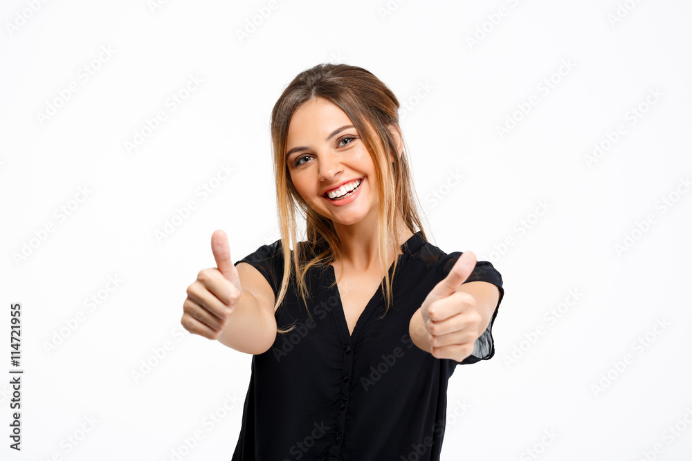 Portrait of young beautiful girl over white background. Thumbs up Portrait of young beautiful girl over white background. Thumbs up