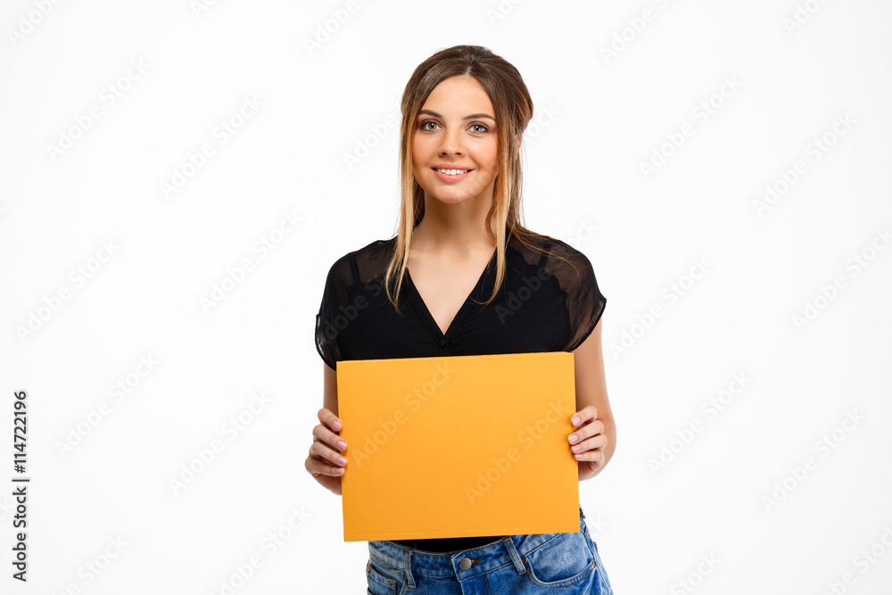 Portrait of young beautiful girl over white background. Copy space.