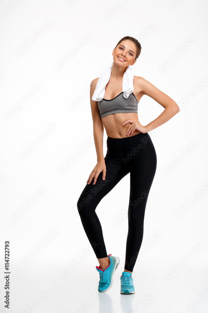 Portrait of young beautiful sportive girl over white background. Portrait of young beautiful sportive girl over white background.