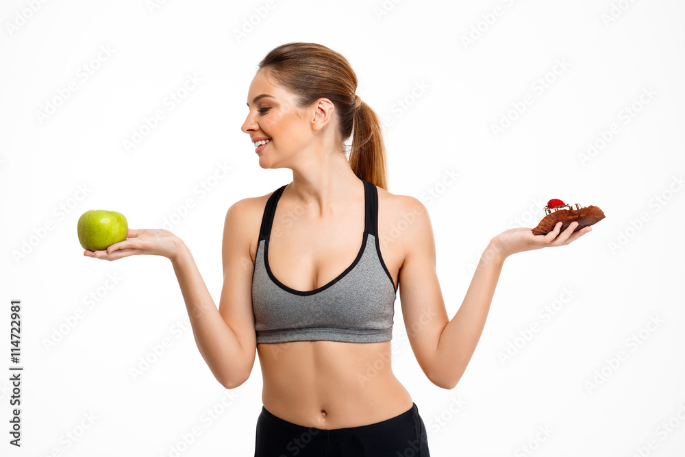 Portrait of young beautiful sportive girl over white background. Portrait of young beautiful sportive girl over white background.