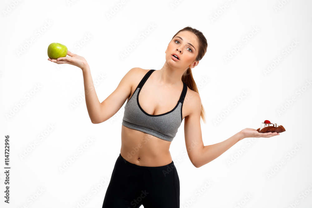Portrait of young beautiful sportive girl over white background. Portrait of young beautiful sportive girl over white background.