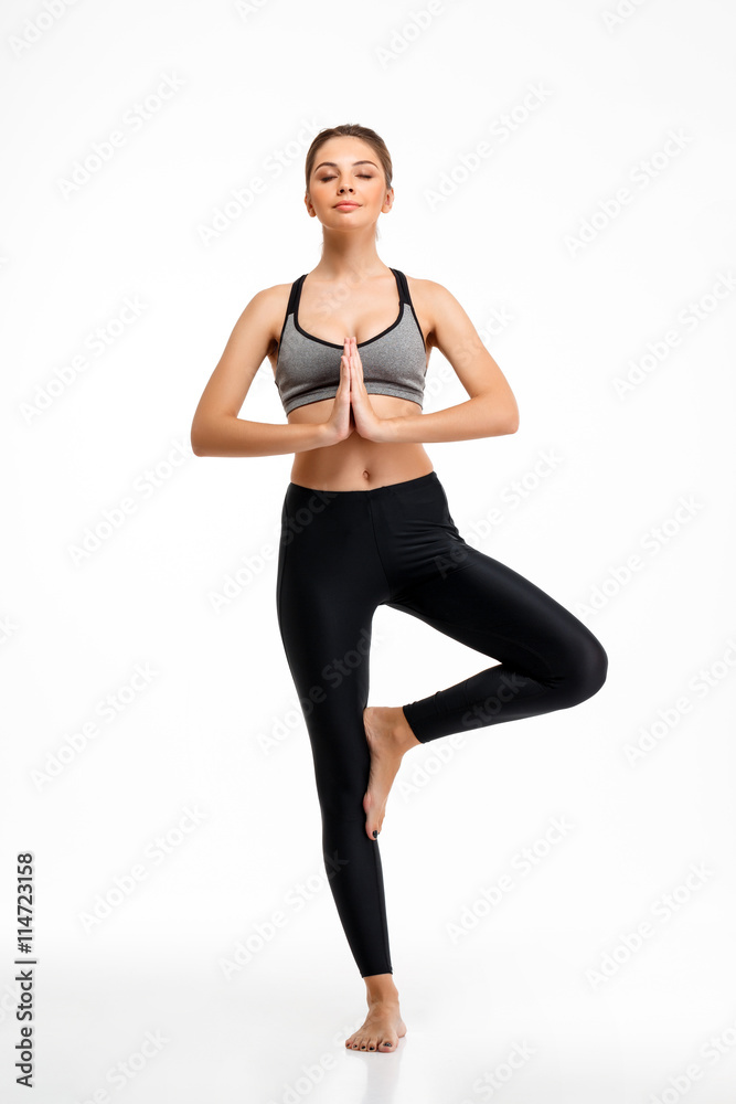 Portrait of young beautiful sportive girl over white background. Portrait of young beautiful sportive girl over white background.