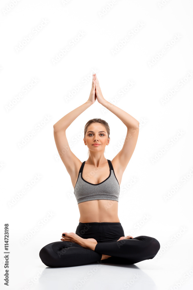 Portrait of young beautiful sportive girl over white background. Portrait of young beautiful sportive girl over white background.