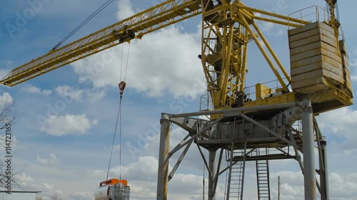 Wallpaper Mural Yellow Hoisting Crane Moving with Cistern Torontodigital.ca