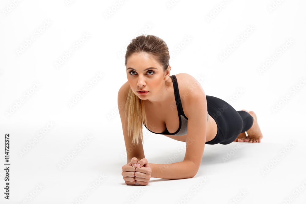 Portrait of young beautiful sportive girl over white background. Portrait of young beautiful sportive girl over white background.