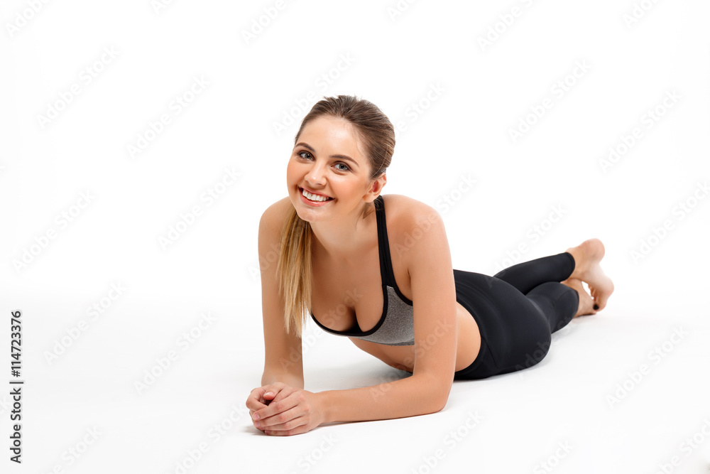 Portrait of young beautiful sportive girl over white background. Portrait of young beautiful sportive girl over white background.