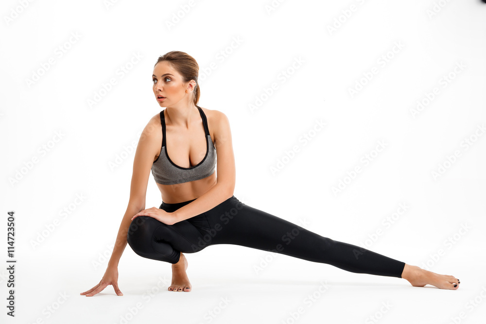 Portrait of young beautiful sportive girl over white background. Portrait of young beautiful sportive girl over white background.