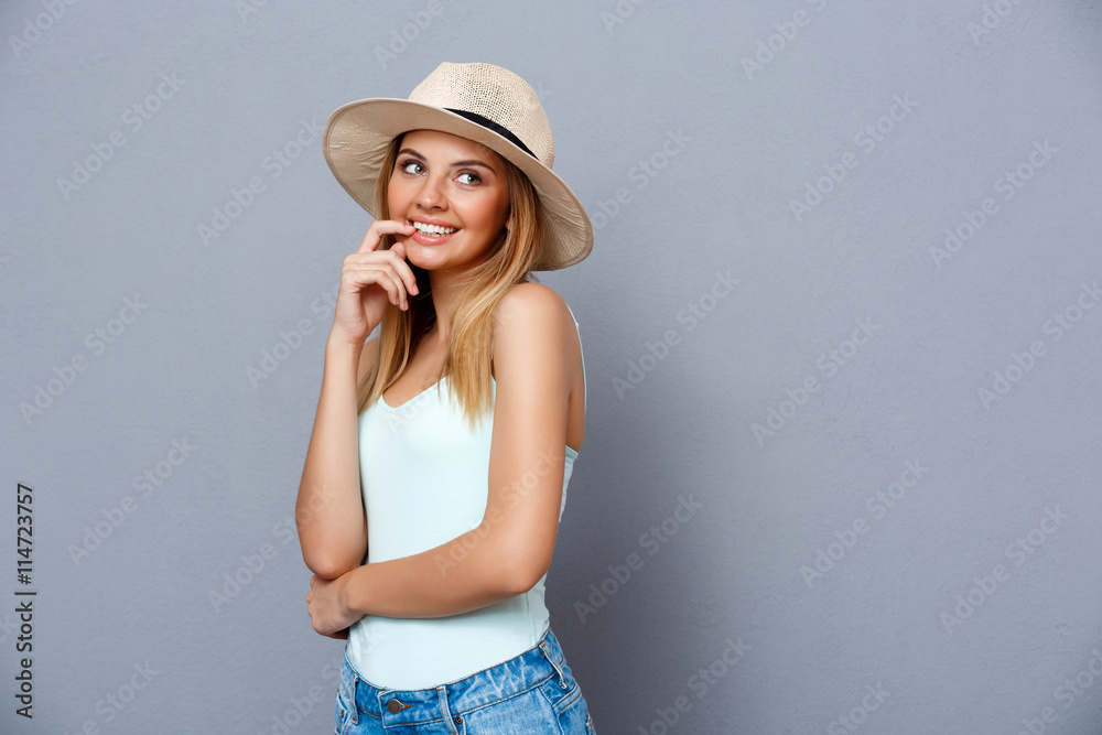 Portrait of young beautiful girl over gray background. Copy space. Portrait of young beautiful girl over gray background. Copy space.