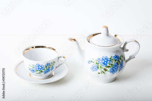 Cup of tea with teapot in vintage style